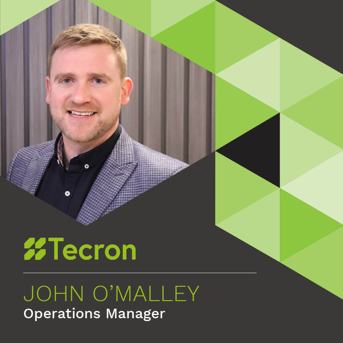 ohn O'Malley, Operations Manager at Tecron, smiling in the office